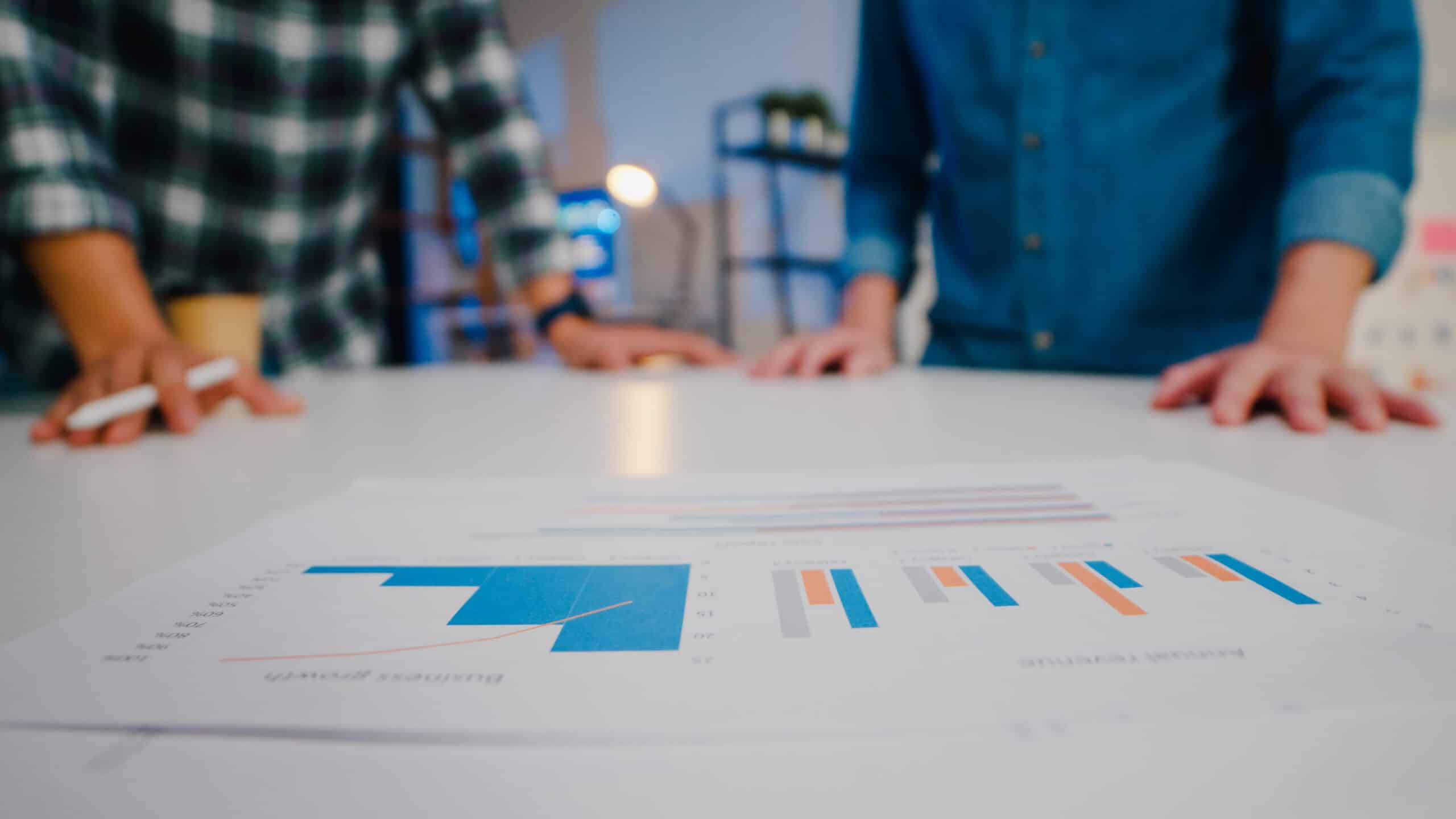 Real estate professionals analyzing housing market reports to help homeowners sell my home Twin Falls at the best possible price. Sell home in twin falls