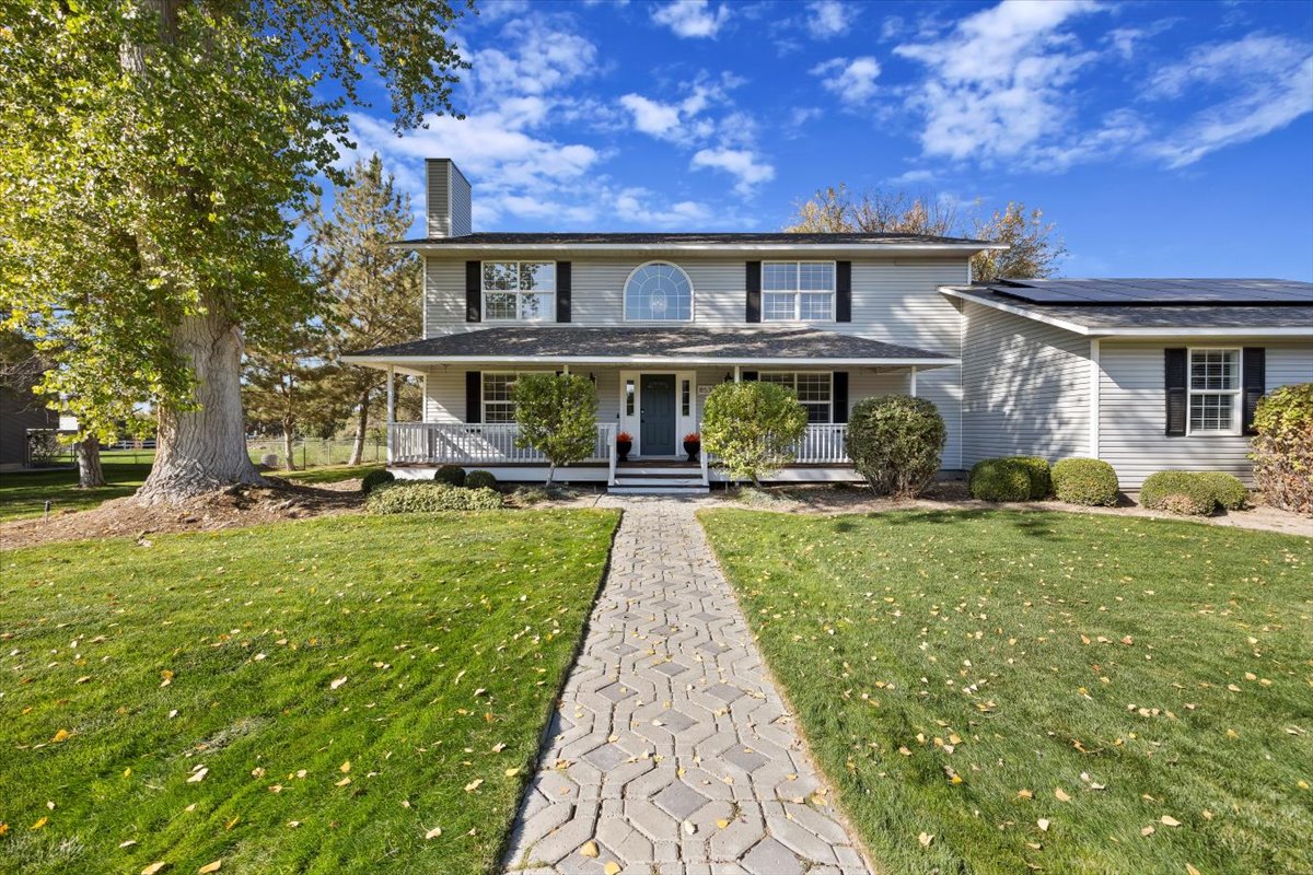 Contemporary luxury residence surrounded by vibrant landscaping, highlighted in a Twin Falls real estate blog covering local market trends and home design.