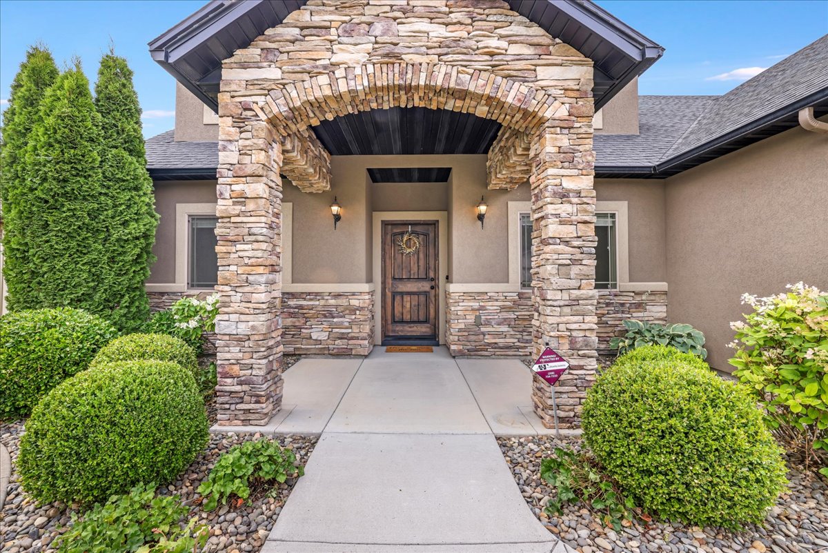 Beautiful custom home with manicured landscaping showcasing premium properties available through Magic Valley real estate.