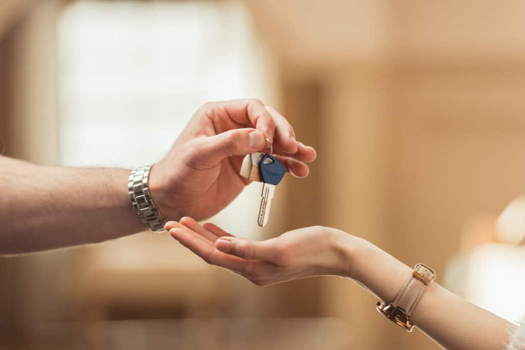 First Time Home Buyer Idaho: Idaho : Man aHanding Key to Woman for Closing Day
